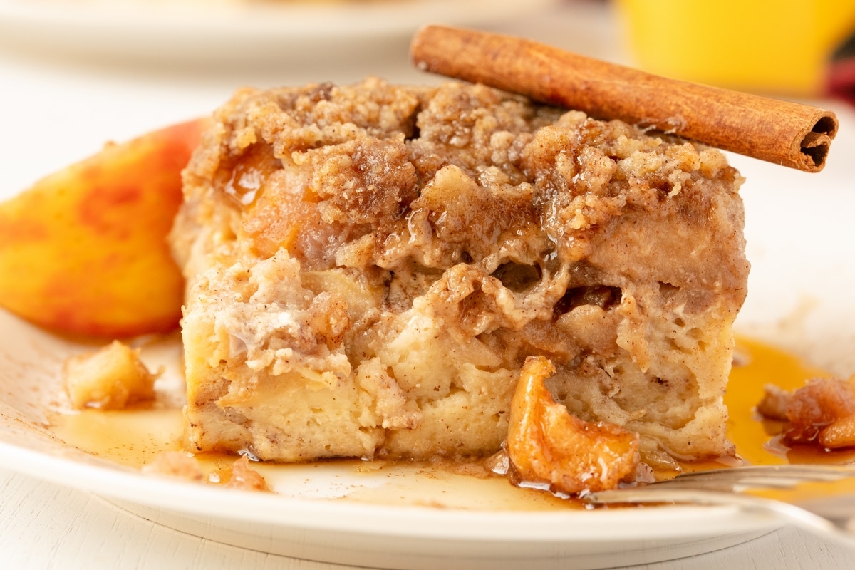 Apple Pie French Toast Casserole Slice Slice of apple pie french toast casserole topped with cinnamon crumble.