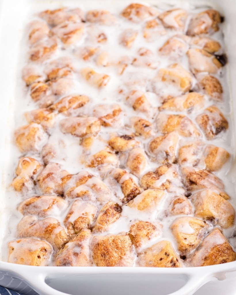 Wake up to the aroma of freshly baked cinnamon rolls with this easy cinnamon roll casserole recipe, perfect for feeding a hungry crowd! Made with Pillsbury refrigerated cinnamon rolls, this easy brunch recipe is simple to put together and an easy breakfast everyone loves. cinnamon bun casserole