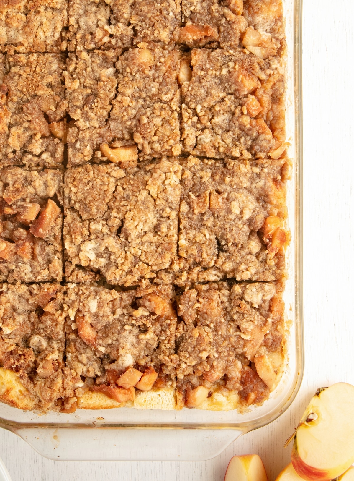 Apple Pie Breakfast Casserole Cinnamon crumble topping on baked apple pie breakfast casserole.