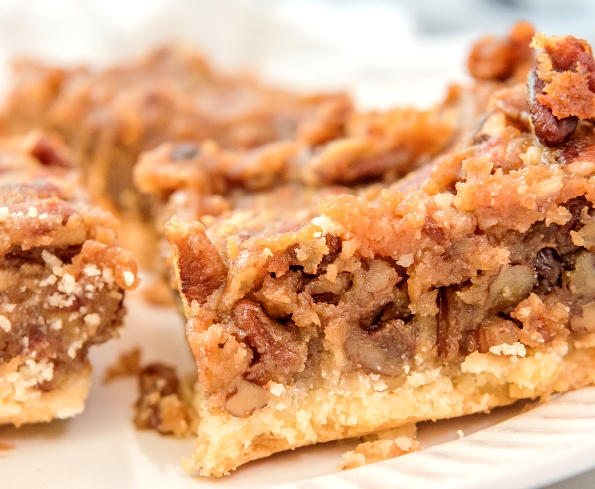 These pecan pie bars pack all the classic flavor of pecan pie into easy, bite-sized squares with a buttery shortbread crust. Perfect for serving a crowd—no pie making skills are necessary for this recipe. bars pecan pie