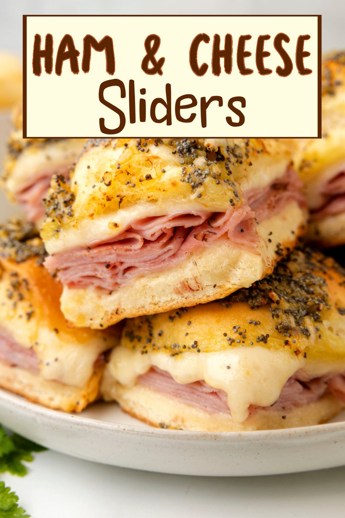 These ham and cheese sliders are perfect for game day or a quick, tasty meal. The soft Hawaiian rolls soak up the buttery drizzle, and the poppy seeds give them a nice finish. via @cmpollak1
