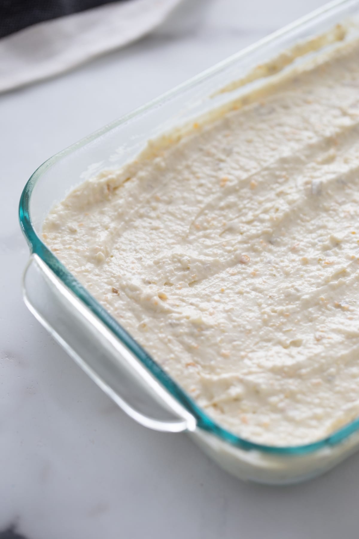 Jalapeño Popper Dip before it's baked Jalapeño Popper Dip in a dish before baking