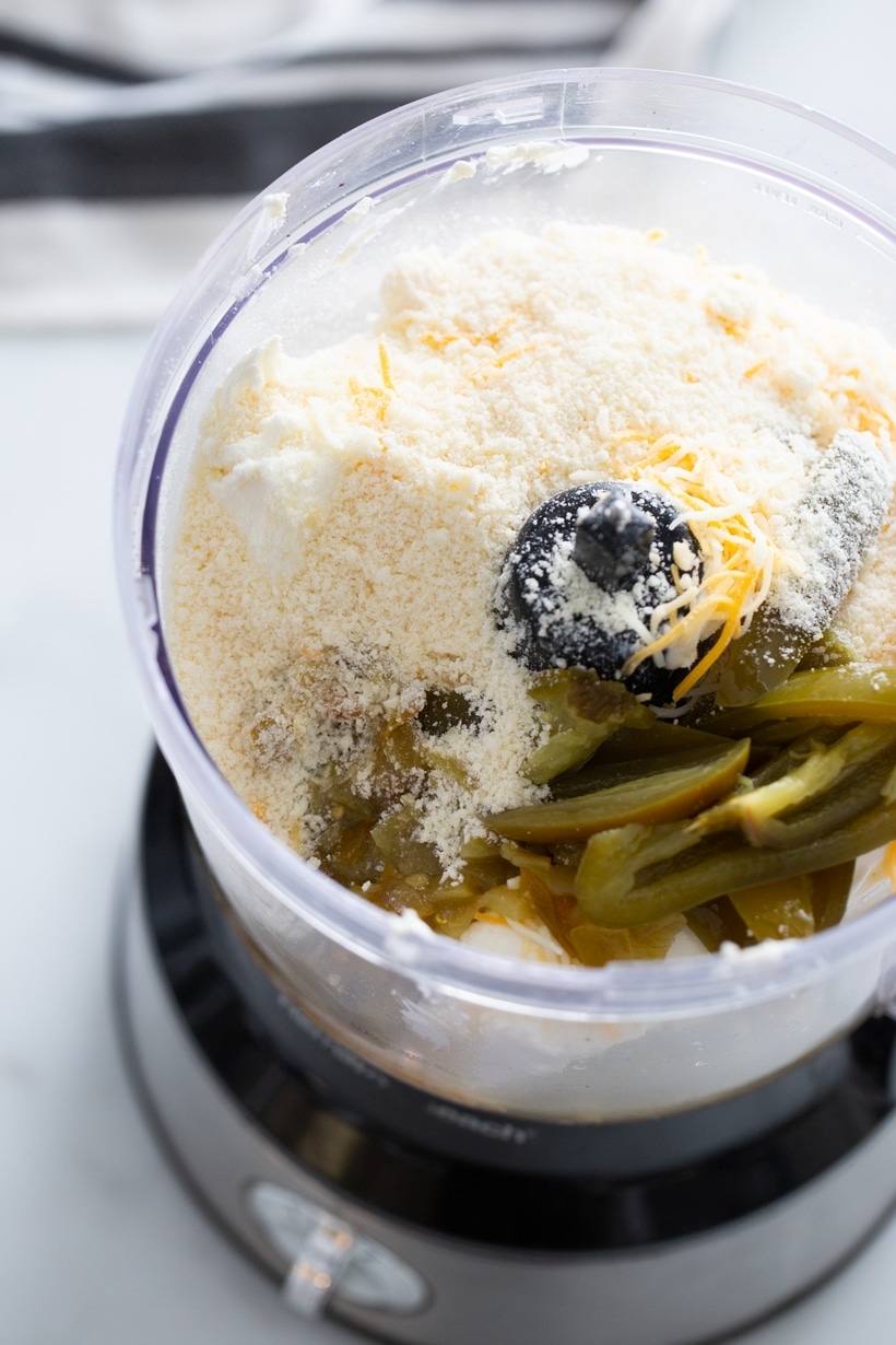 Jalapeno Popper Dip being made in a food processor ingredients in a food processor like jalapenos and cream cheese