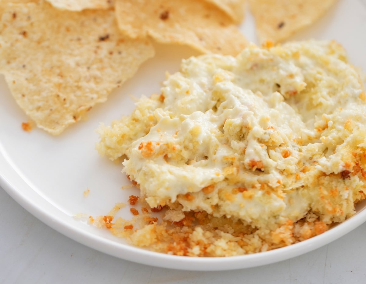 Jalapeño Popper Dip with tortilla chips Jalapeño Popper Dip scooped onto a plate