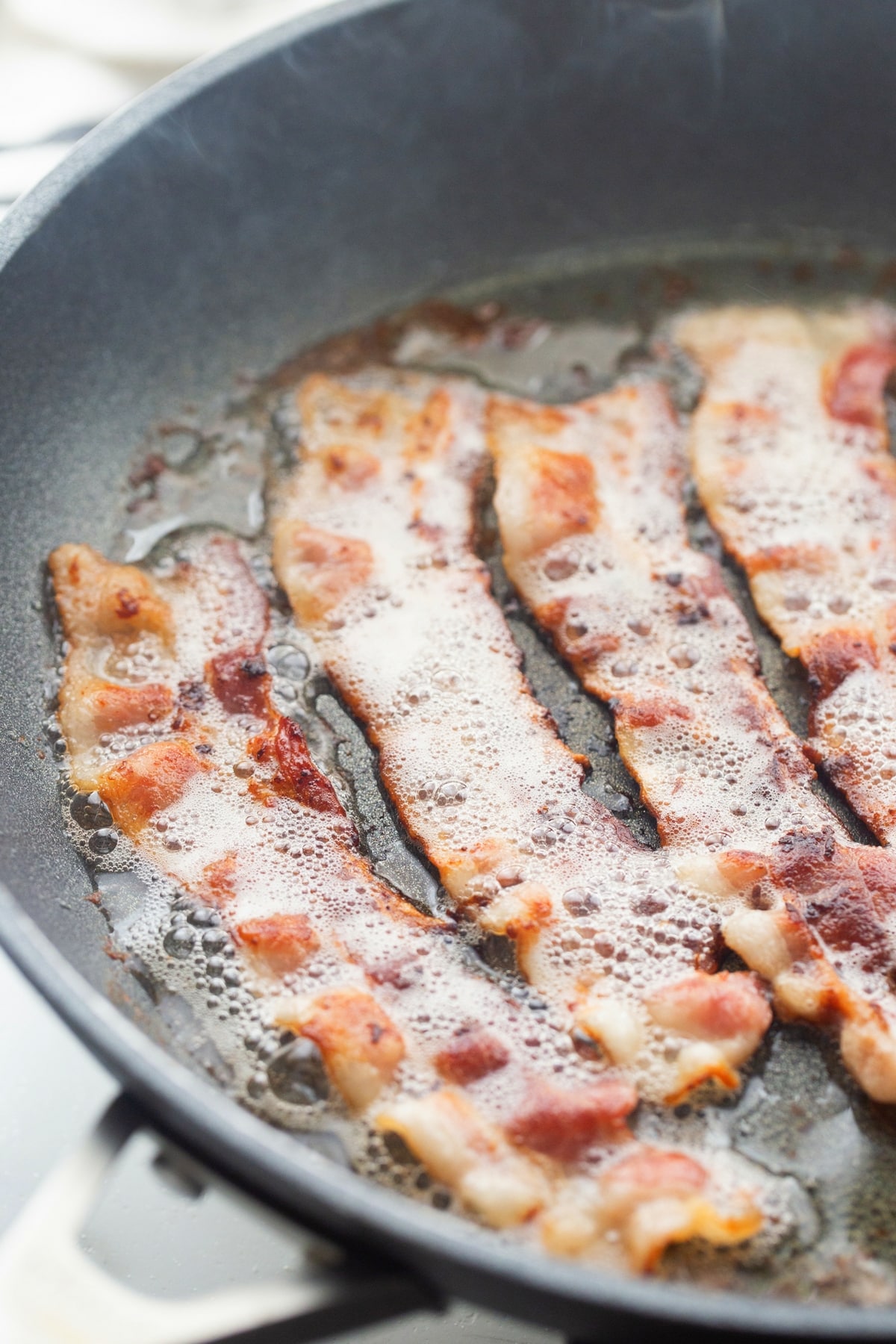 Bacon for Pull-Apart Bacon Bread bacon frying in the pan