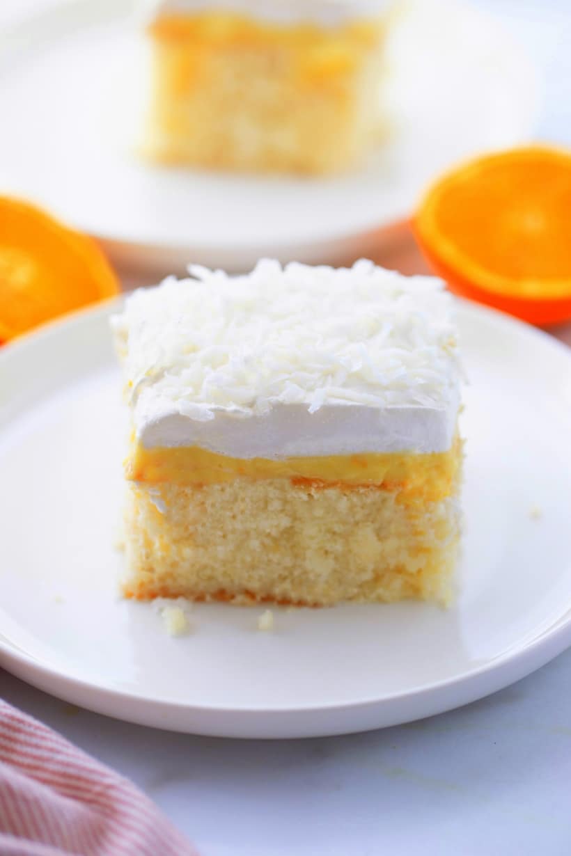 This just might be the dreamiest version of Orange Creamsicle Poke Cake thanks to the addition of cream of coconut incorporated into the cake batter. The layer of intense orange curd adds brightness, while injecting a zesty taste in every bite. This is going to be your favorite poke cake recipe. orange creamsicle poke cake