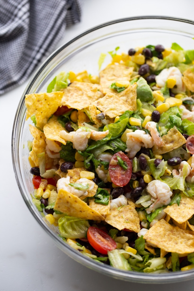 Shrimp and avocado salad packed with all your favorite ingredients and tossed with a simple homemade dressing. This salad is bright, flavorful, zesty and the weeknight meal you are going to make all summer long. shrimp avocado salad