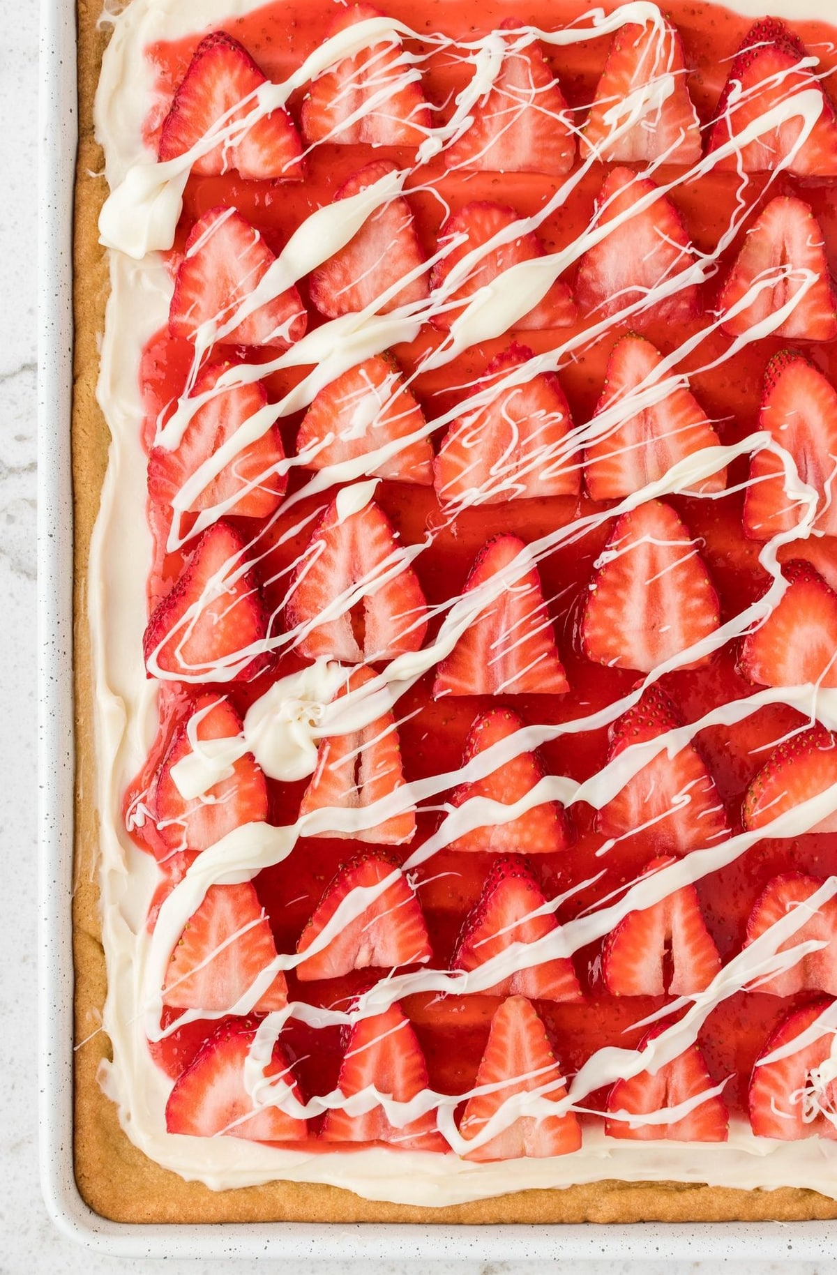 Making strawberry pizza is such a fun process. It’s basically a bright, colorful take on a super easy, light, and airy fruit galette. Seriously, one bite of this gorgeous dessert and you'll be planning to make it again in no time. strawberry pizza