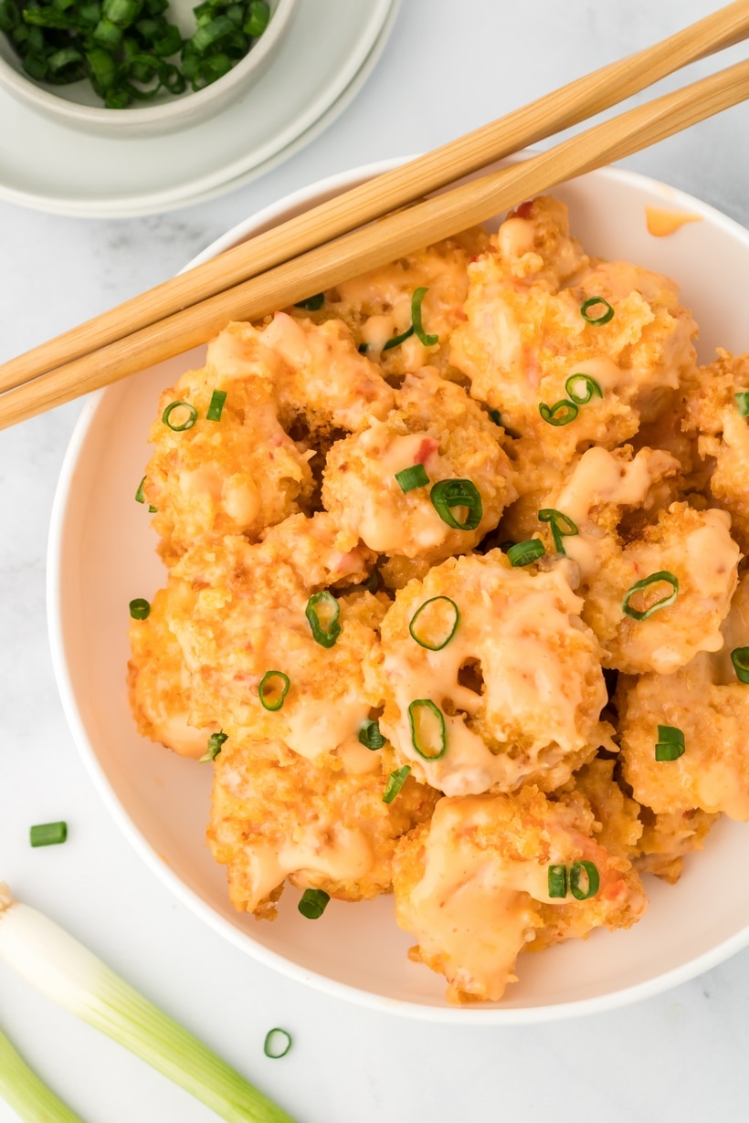 Air fryer bang bang shrimp served in a white bowl with spicy chili mayo