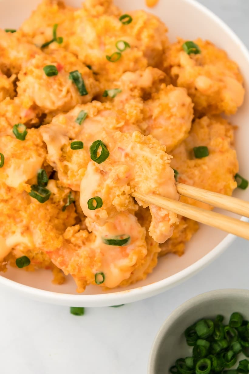 Crunchy air fryer shrimp with sweet and spicy sauce in white bowl