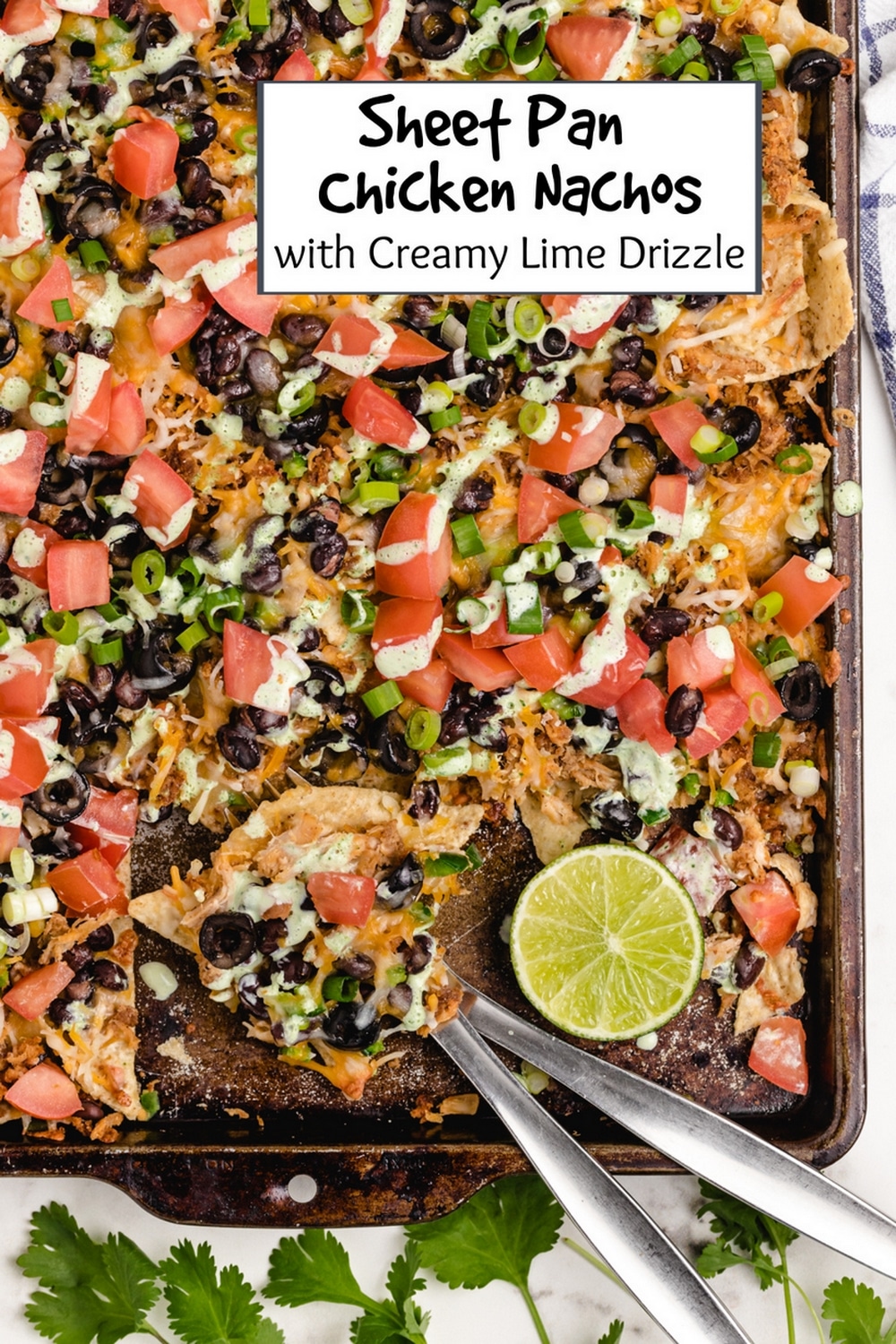 It's time to add these sheet pan chicken nachos with a creamy lime drizzle to your weekly meal plan. These loaded nachos are quick, flavorful, easily customizable and budget friendly. I make them whenever I find myself with leftover rotisserie chicken. via @cmpollak1