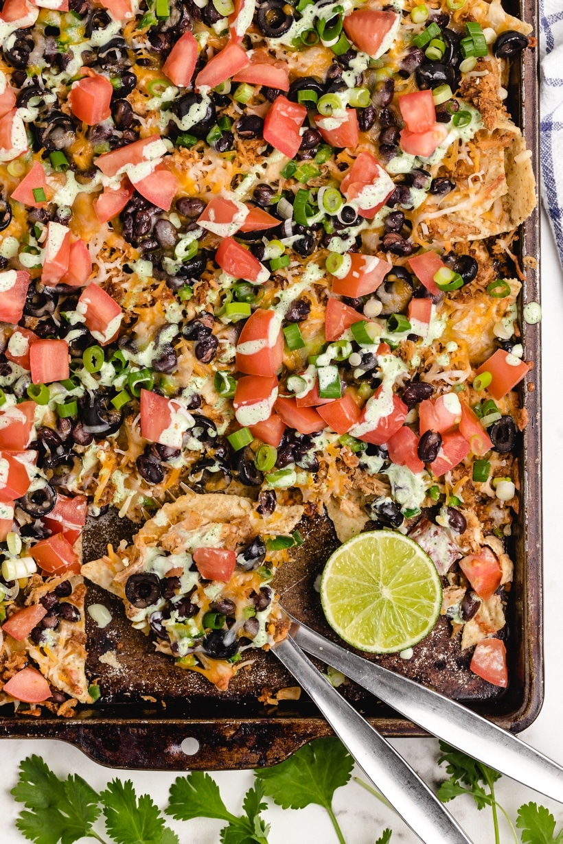 sheet pan chicken nachos with creamy lime drizzle