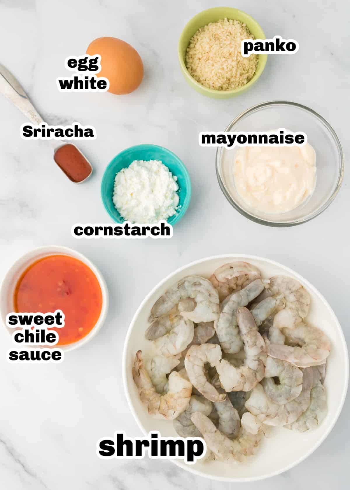 Ingredients for air fryer bang bang shrimp laid out on a white surface