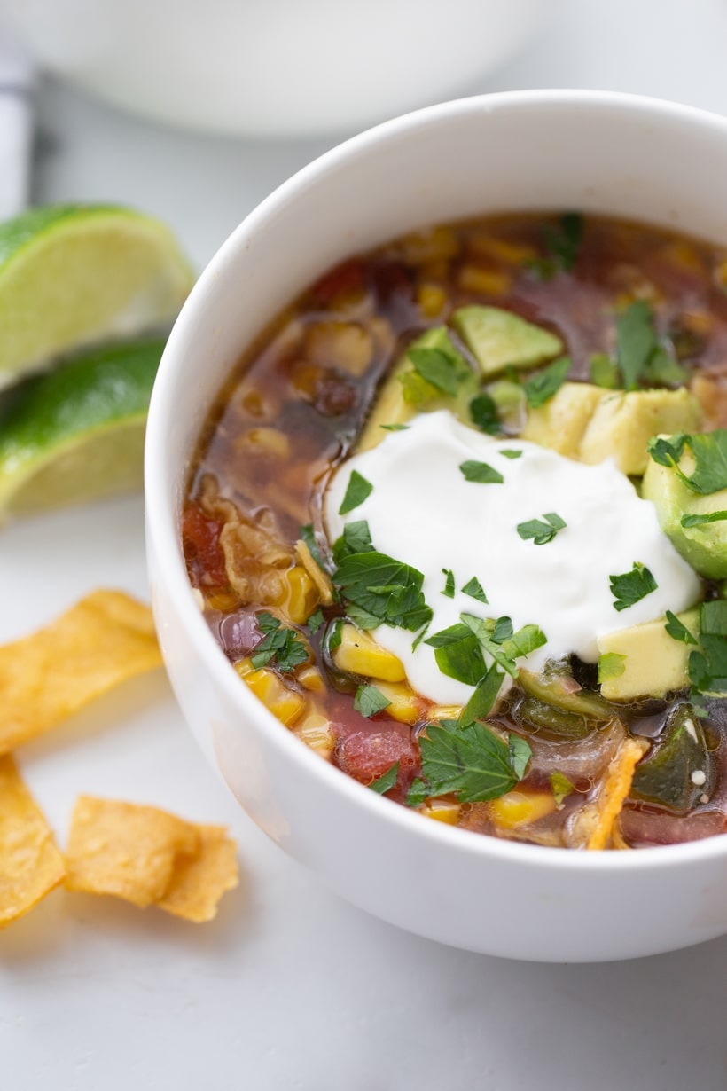 A zesty corn and salsa based tortilla soup that is not only packed with flavor, but can be on the dinner table in under an hour. vegetarian tortilla soup
