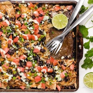 sheet pan chicken nachos with creamy lime drizzle