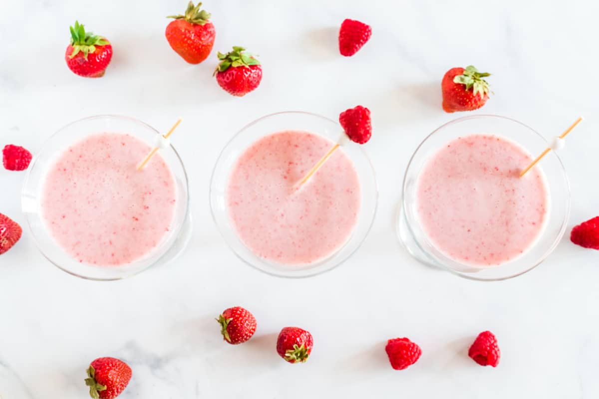 Overhead shot of the frozen martini, showing its smooth, creamy texture with a strawberry garnish.