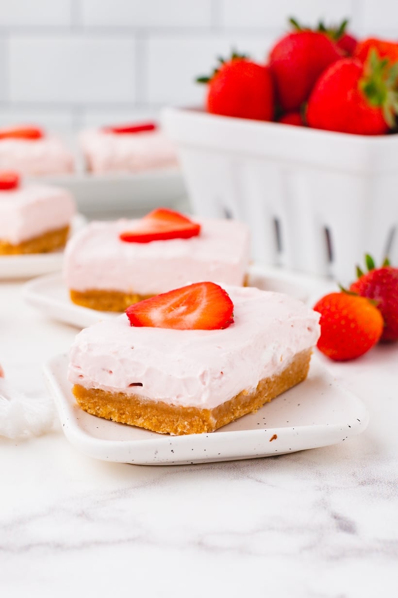 No-bake strawberry cheesecake bars slightly softened at room temperature