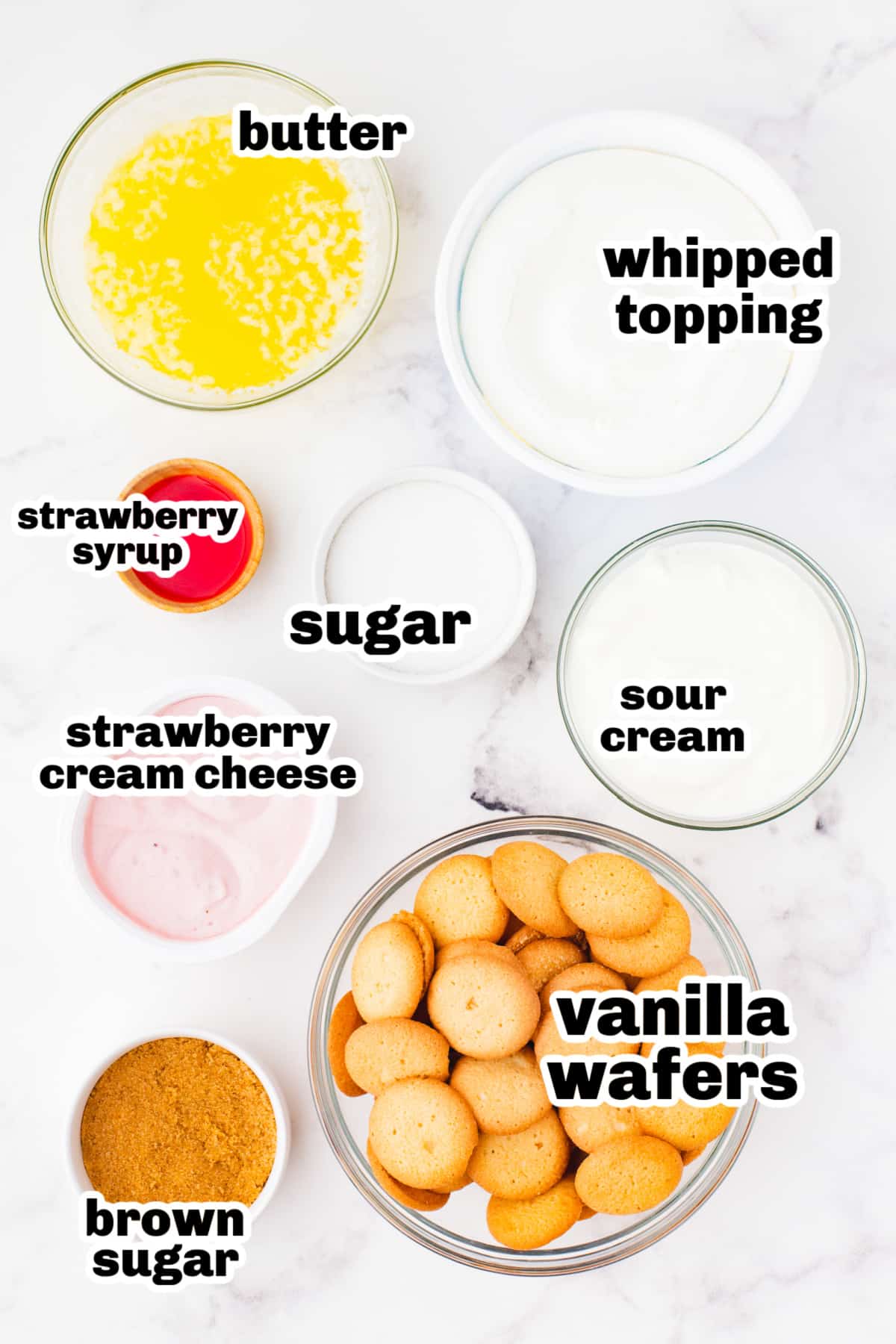 Ingredients laid out for no-bake strawberry cheesecake bars