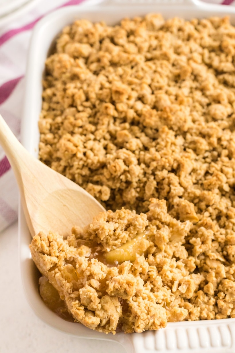 This particular apple crisp is the lazy baker's best friend. Not only will you get all the satisfaction and flavor of apple pie, this simple apple crisp is going to be ready in half the time. Warmly spiced apple pie filling is topped with sweet, buttery oats that crack under the pressure of a spoon. Don't forget a scoop of vanilla ice cream on top. Apple Crisp easy recipe