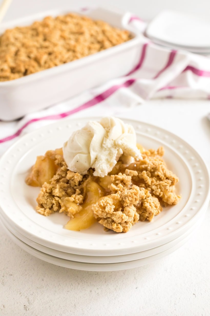 This particular apple crisp is the lazy baker's best friend. Not only will you get all the satisfaction and flavor of apple pie, this simple apple crisp is going to be ready in half the time. Warmly spiced apple pie filling is topped with sweet, buttery oats that crack under the pressure of a spoon. Don't forget a scoop of vanilla ice cream on top. quick and easy apple crisp