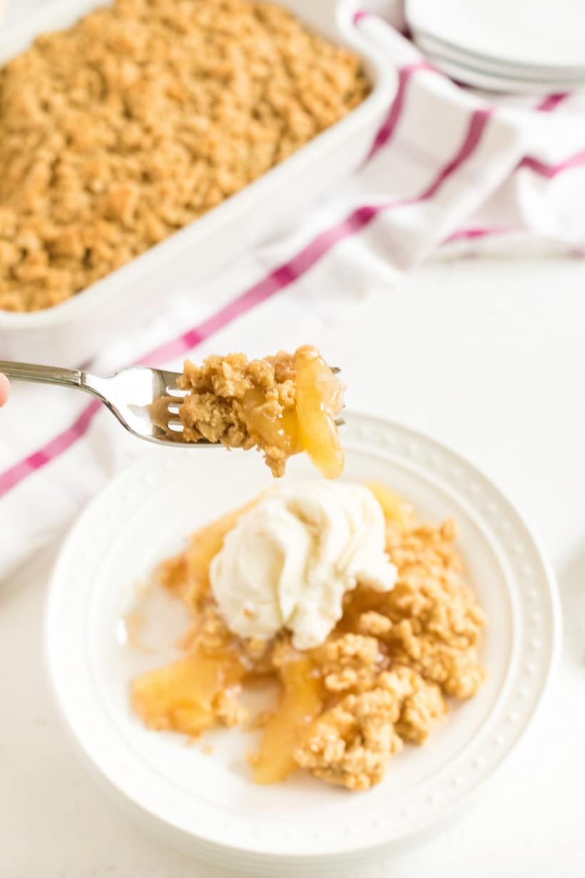 This particular apple crisp is the lazy baker's best friend. Not only will you get all the satisfaction and flavor of apple pie, this simple apple crisp is going to be ready in half the time. Warmly spiced apple pie filling is topped with sweet, buttery oats that crack under the pressure of a spoon. Don't forget a scoop of vanilla ice cream on top. old fashioned apple crisp