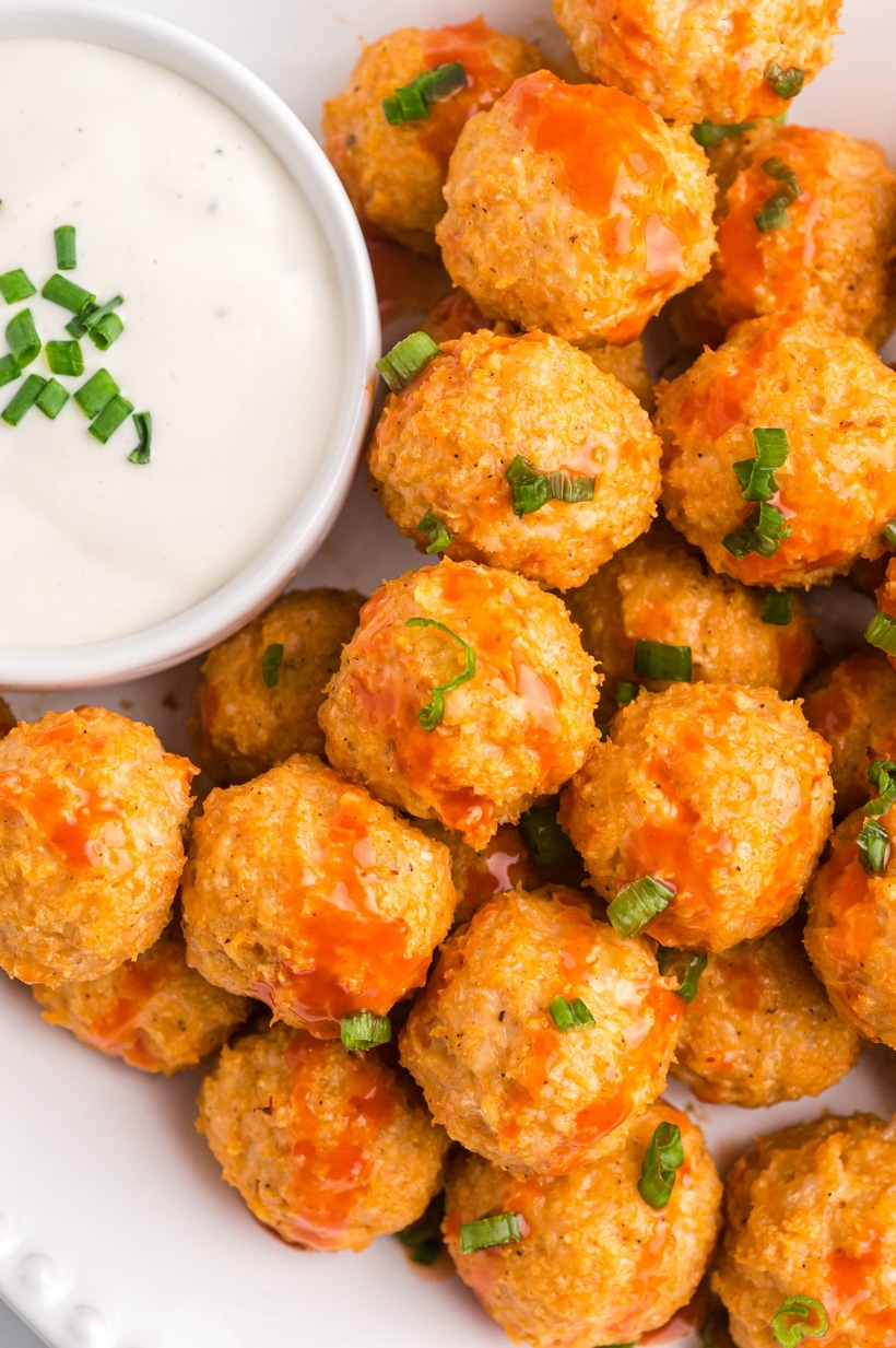 Buffalo Chicken Meatballs on a game day platter buffalo chicken meatballs on a platter with dipping sauce