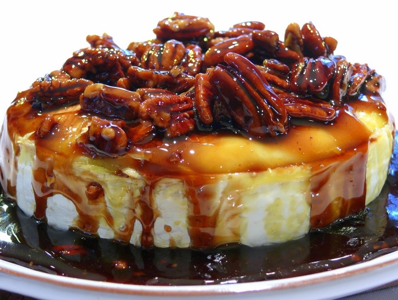 This Kahlua-Pecan-Brown Sugar Baked Brie is going to rock your next party, gathering or celebration. The brie comes out of the oven gooey and oozing and awaiting it’s sweet and delicious topping. It is a must make any time of the year. kahlua Brie