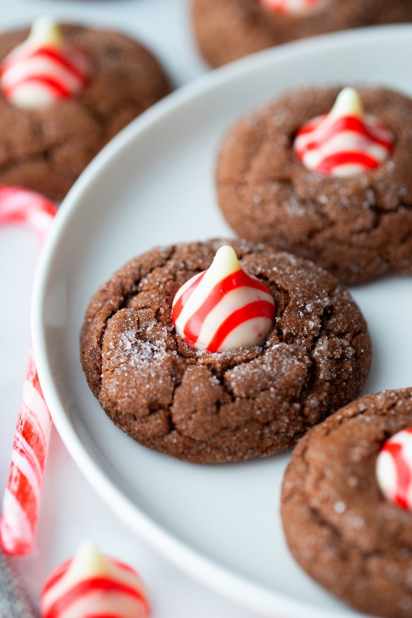 Dark Chocolate Peppermint Crackle Cookie highlighting the crackle and Hershey's Kiss.