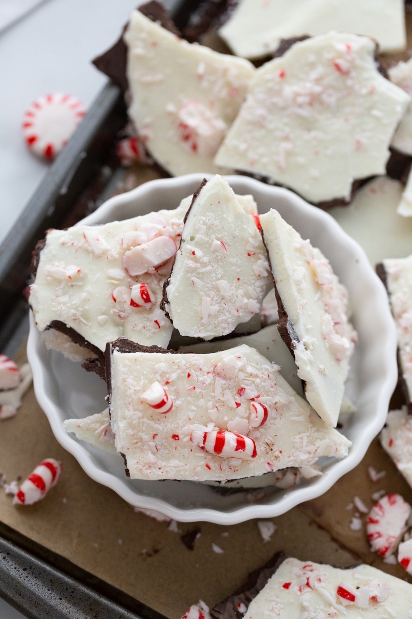 Peppermint Bark Pieces in a Ramekin Overhead shot of broken pieces of double chocolate peppermint bark in a ramekin.