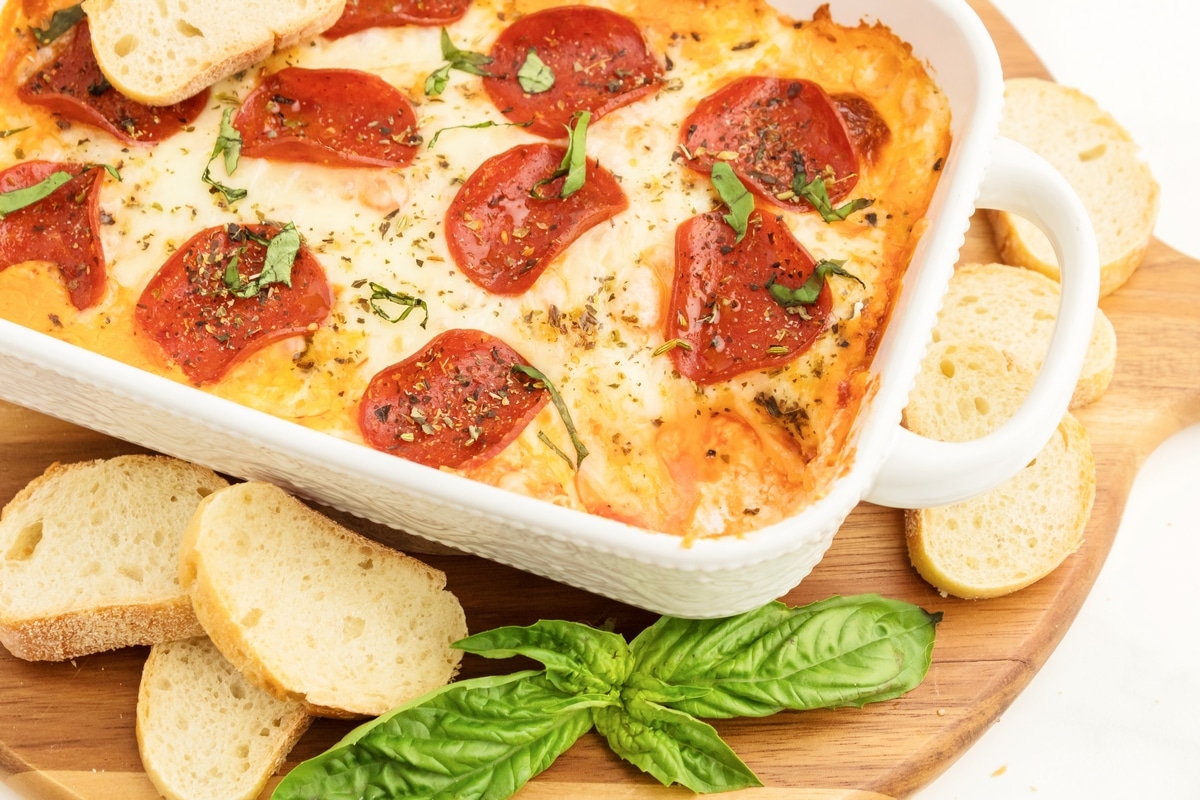 gooey pizza dip in a white baking dish