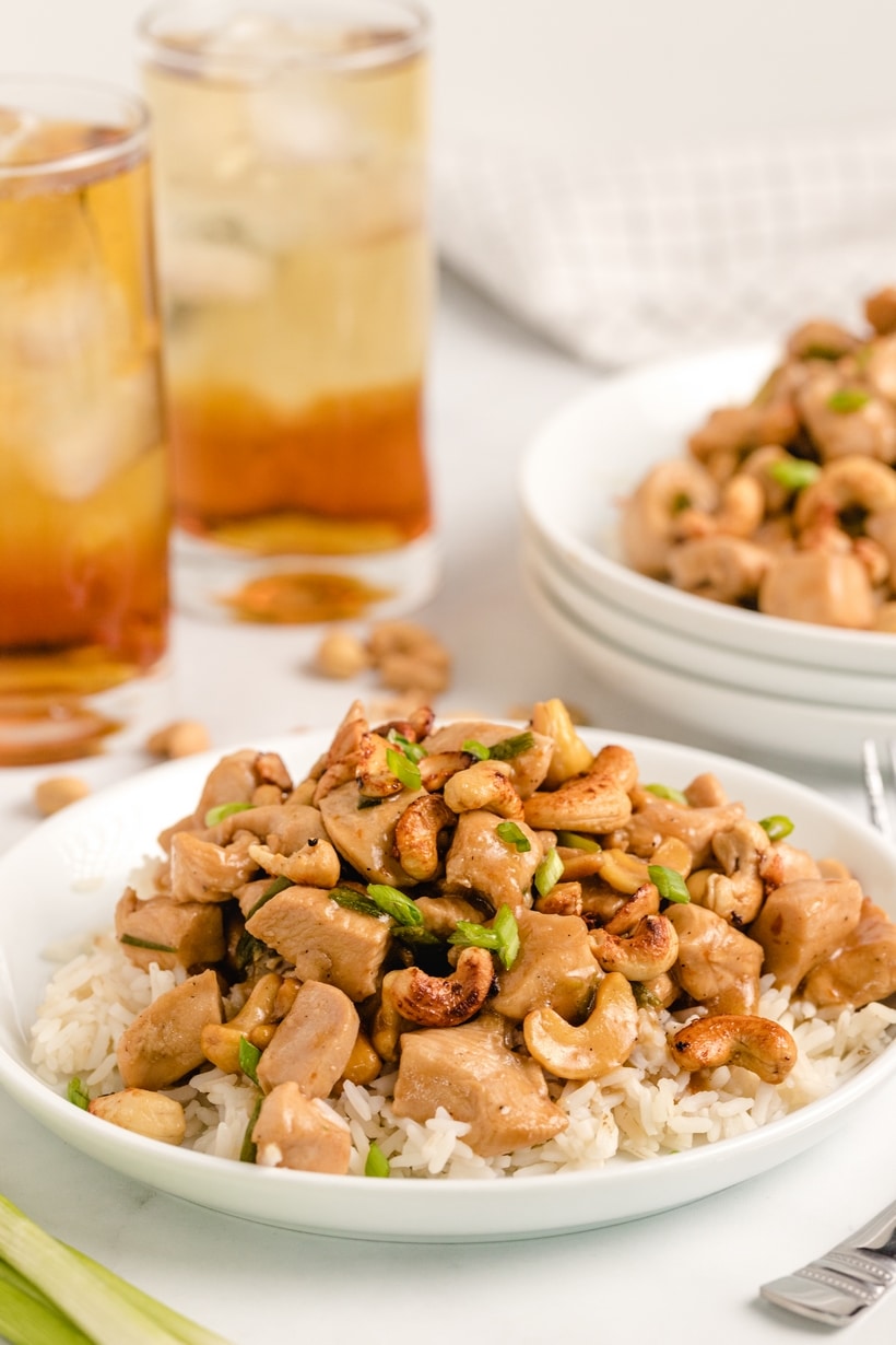 Easy homemade kung pao chicken recipe Close up of kung pao chicken on a plate with rice.
