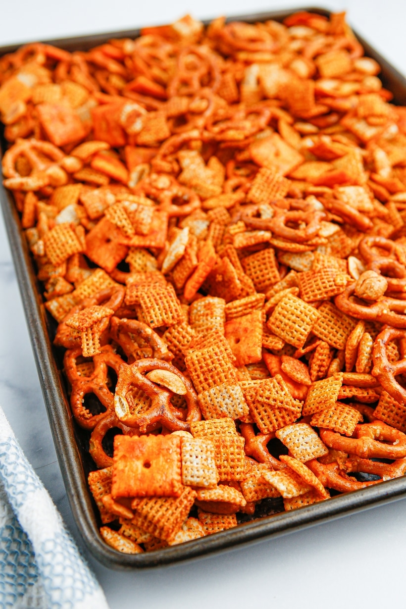 BBQ Chex mix spread on a baking tray