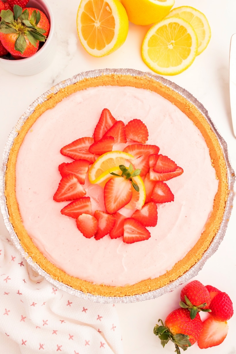 whole frozen strawberry lemonade pie from above Overhead view of the full no bake strawberry lemonade pie