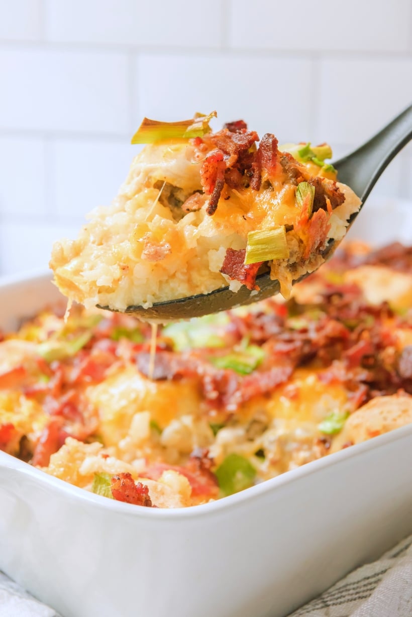 This overnight breakfast casserole is the answer to an easy, all-in-one breakfast. Biscuits, bacon, sausage, and tater tots—basically all the best parts of a breakfast plate in a single bite. breakfast casserole with tater tots