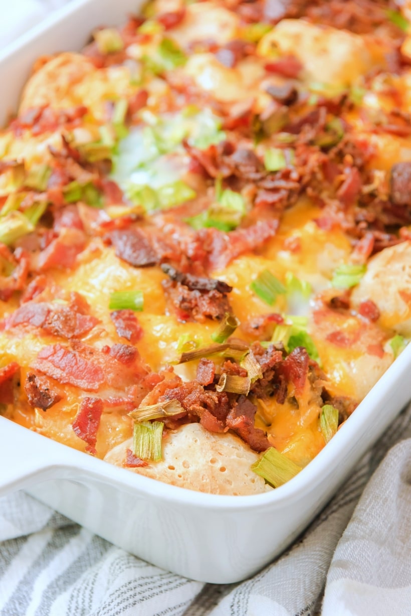 This overnight breakfast casserole is the answer to an easy, all-in-one breakfast. Biscuits, bacon, sausage, and tater tots—basically all the best parts of a breakfast plate in a single bite. overnight breakfast casserole