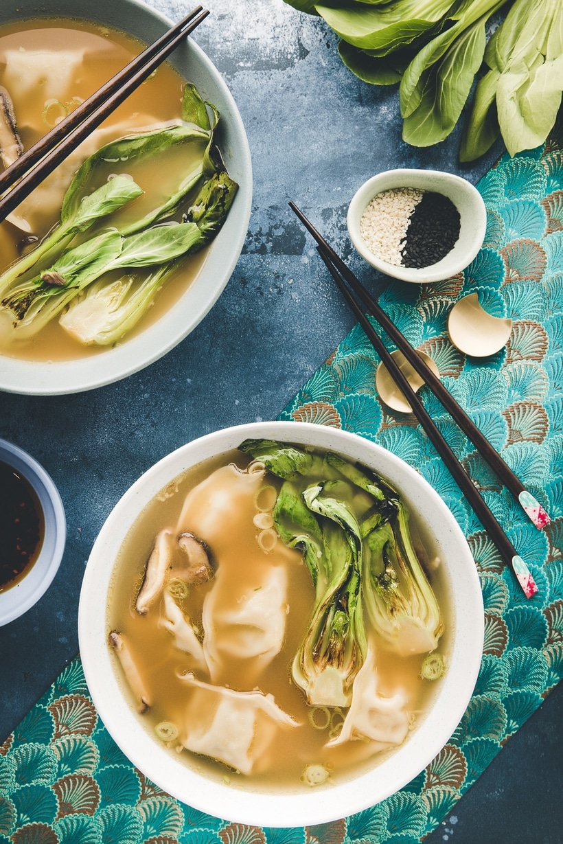 wonton soup base with an overhead view of two bowls.