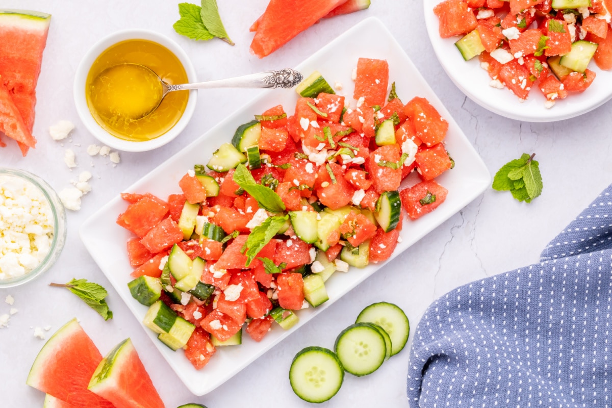 Detailed top view of chilled watermelon salad with cucumber and feta Overhead close-up showing juicy watermelon cubes, cucumber slices, and crumbled feta
