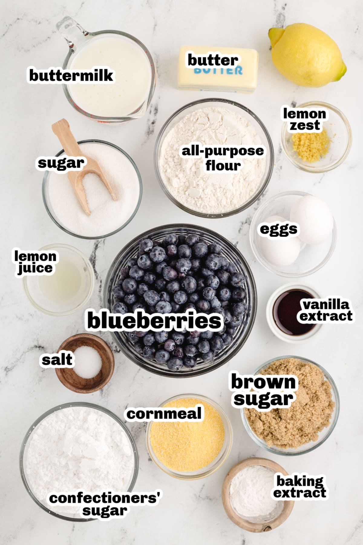 Lemon Cornmeal Cake ingredients Overhead shot of all the ingredients for the lemon cornmeal cake and blueberry sauce.