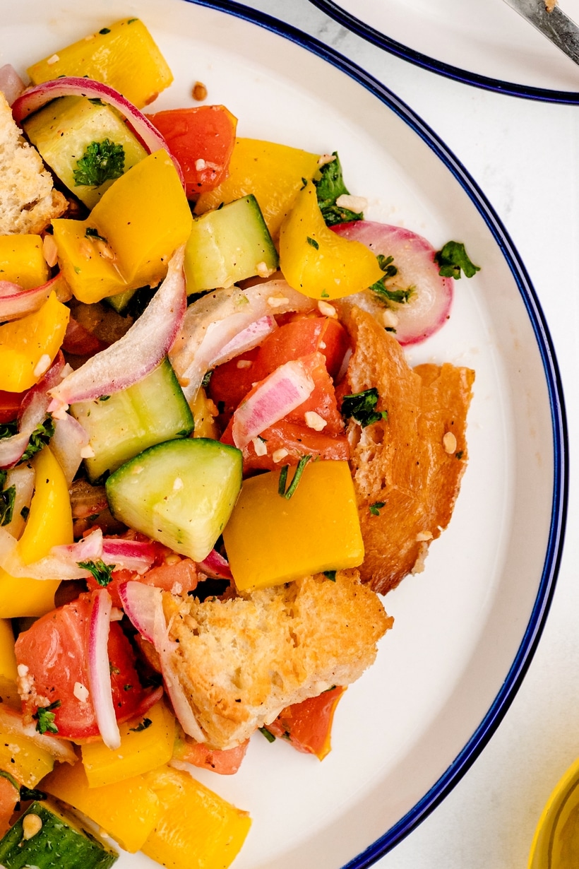 Panzanella, or Italian bread salad, is a Tuscan favorite that's hard to resist. It's all about that perfect combo of crusty, day-old bread soaking up the juices from the ripest, juiciest tomatoes—once you start, it's impossible to stop. bread salad