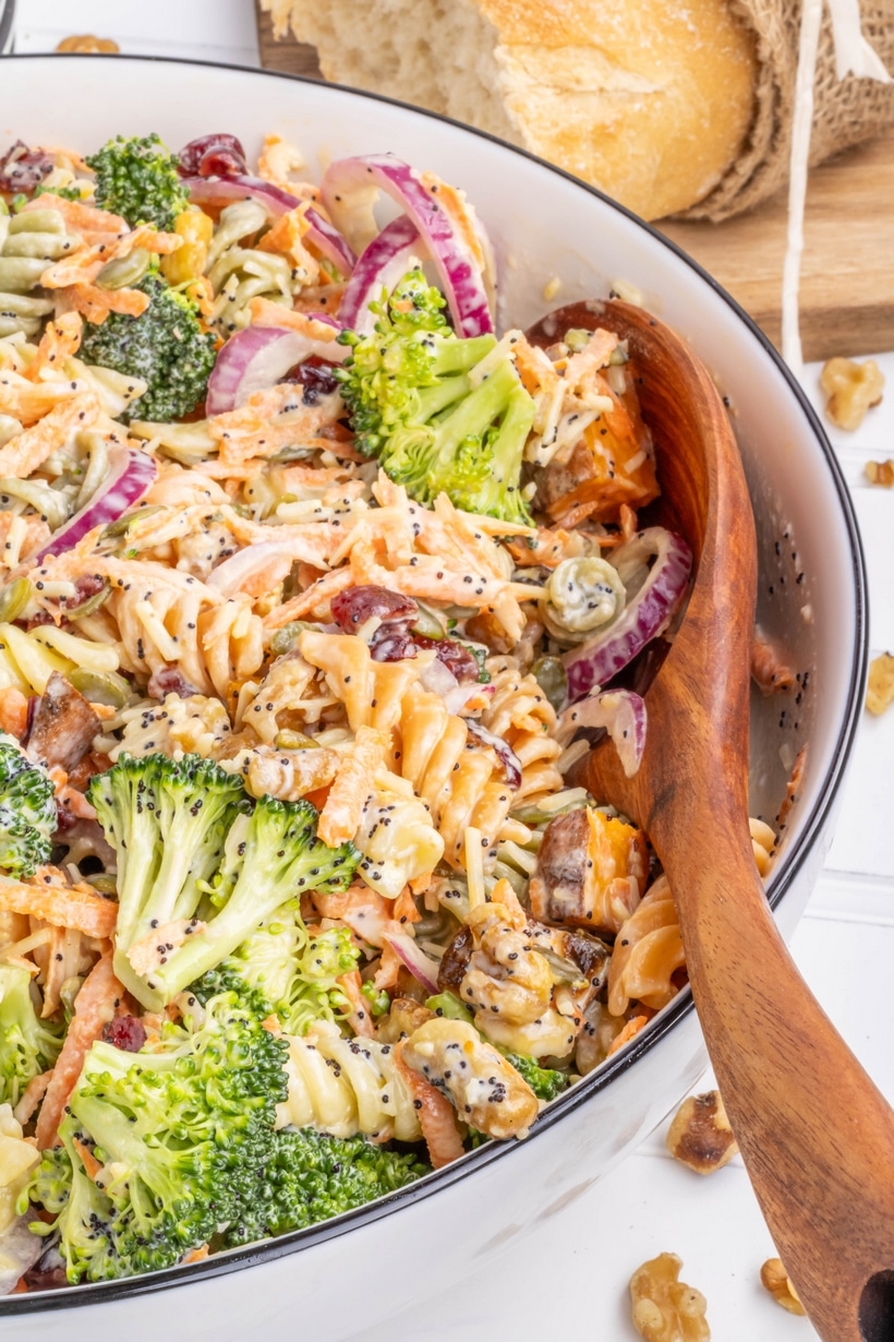 Shake up your fall season meals with this savory and delicious Sweet Potato Pasta Salad. This hearty side dish is packed with flavor and crunch and tied together with a homemade poppy seed dressing. winter pasta salad with sweet potatoes