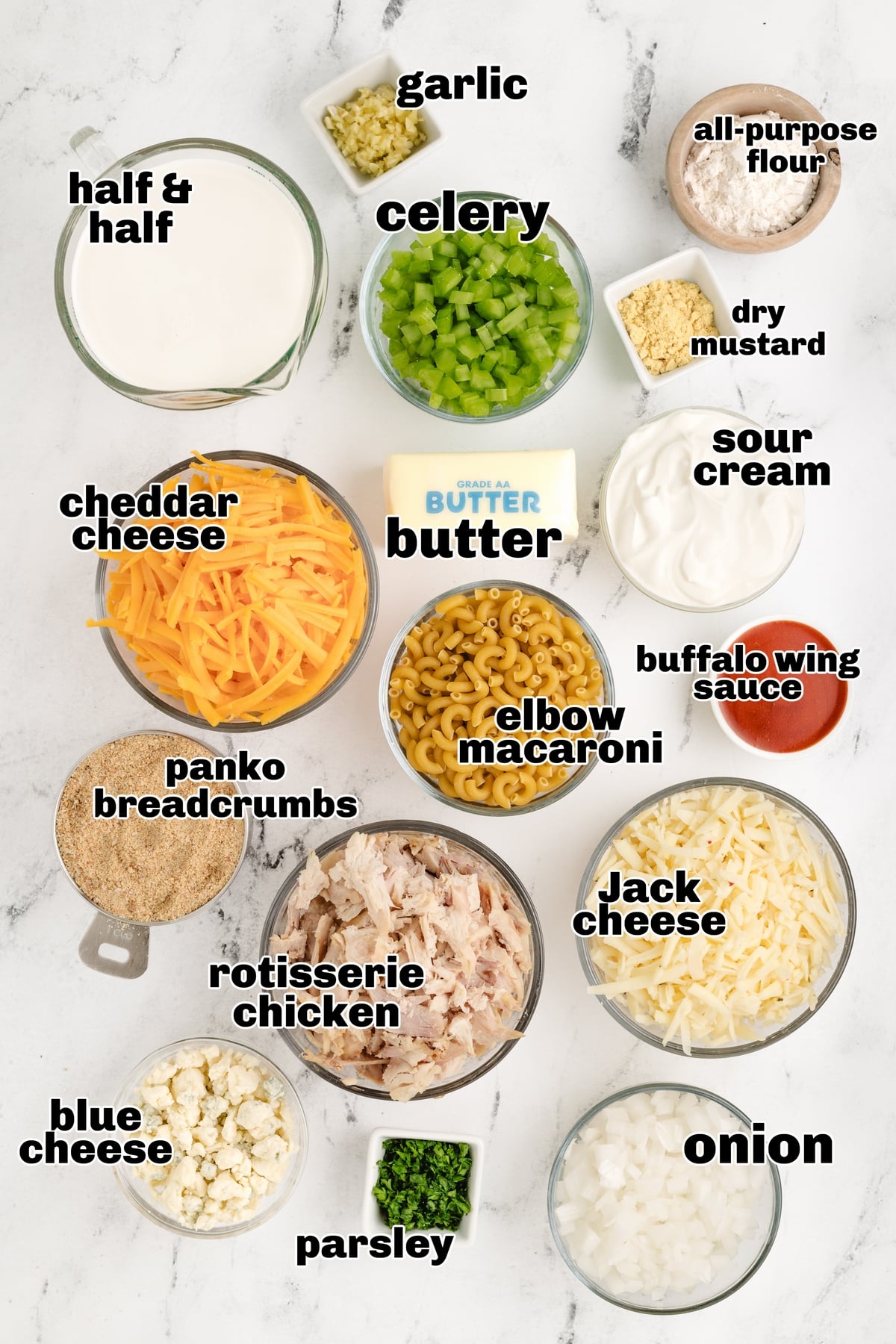 Ingredients for buffalo chicken mac and cheese layed out on the counter.