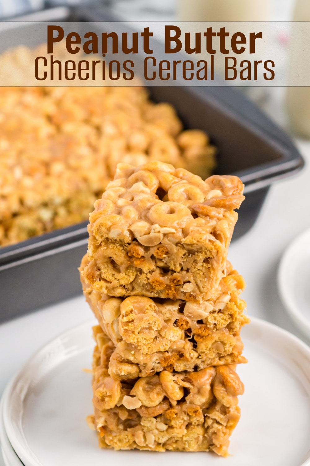 Looking for a quick and tasty snack? Try these delicious Peanut Butter Cheerio Bars. This easy recipe for Cheerios cereal bars is perfect for satisfying your sweet tooth and there isn't a better time than back-to-school season to enjoy them. via @cmpollak1
