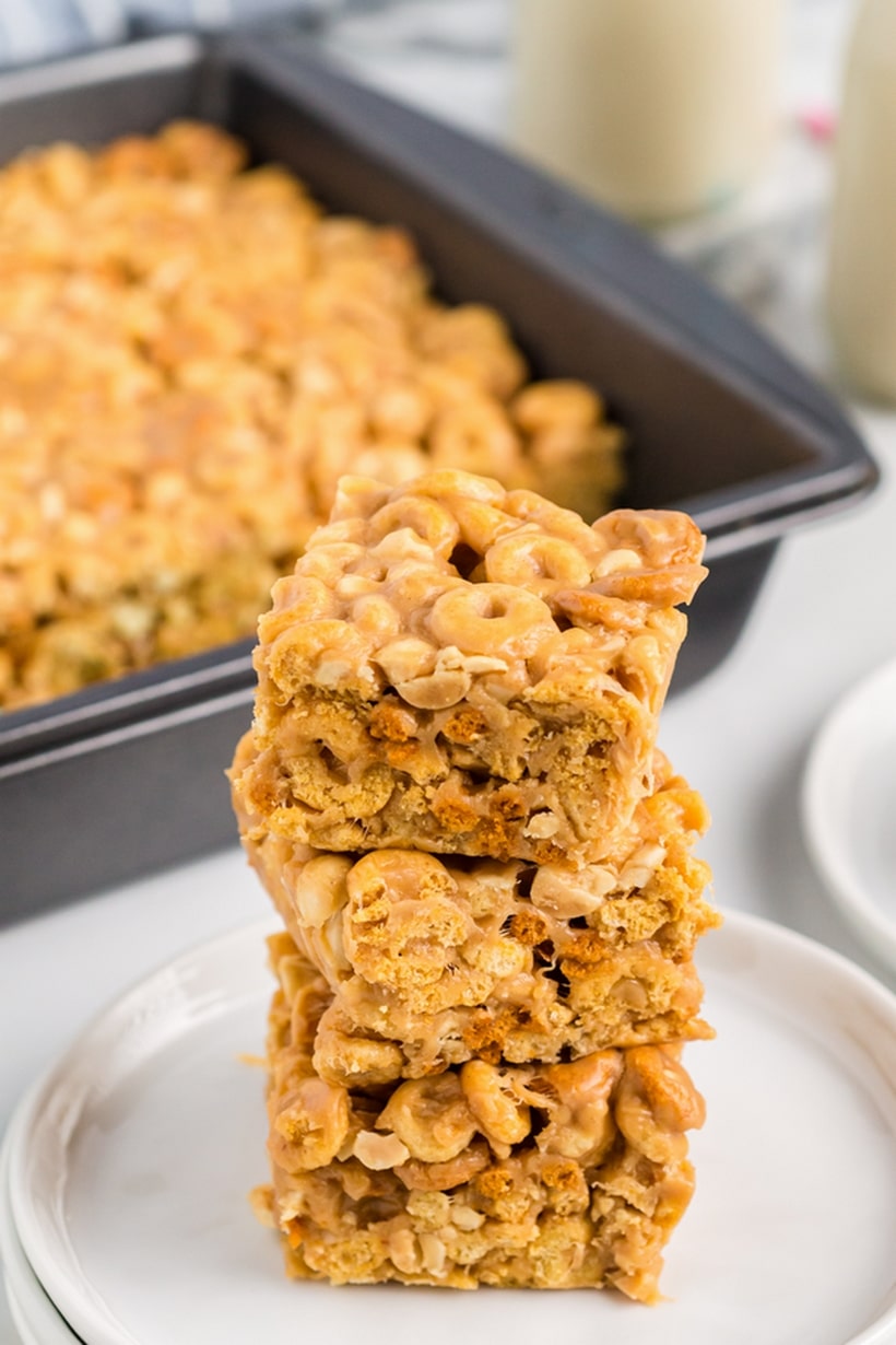 Looking for a quick and tasty snack? Try these delicious Peanut Butter Cheerio Bars. This easy recipe for Cheerios cereal bars is perfect for satisfying your sweet tooth and there isn't a better time than back-to-school season to enjoy them. peanut butter Cheerio bars