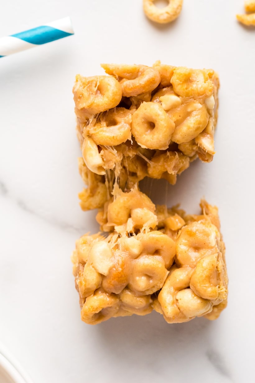 Looking for a quick and tasty snack? Try these delicious Peanut Butter Cheerio Bars. This easy recipe for Cheerios cereal bars is perfect for satisfying your sweet tooth and there isn't a better time than back-to-school season to enjoy them. gooey cereal bars