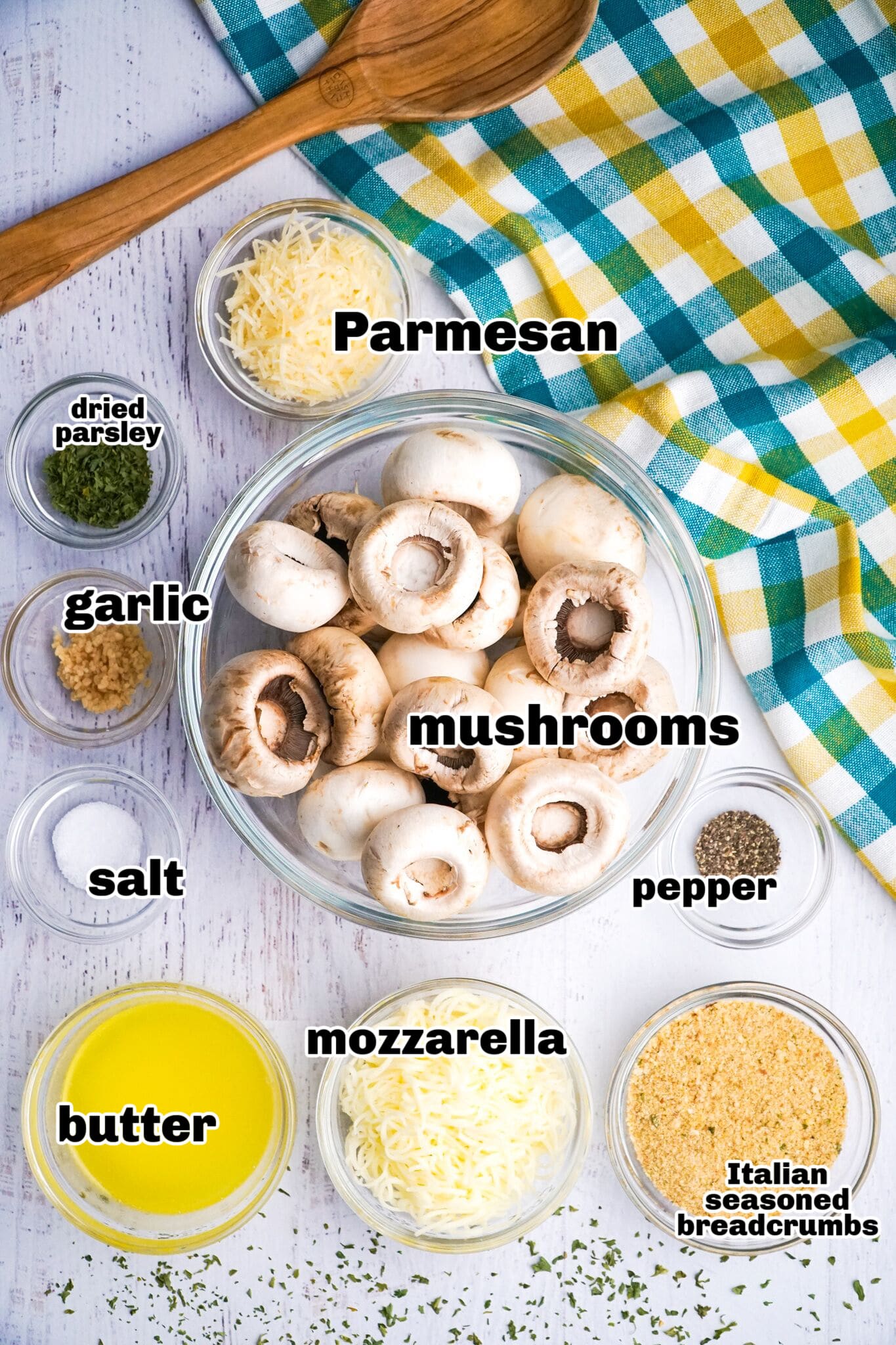 Ingredients for Italian stuffed mushrooms ready to be used. All ingredients for Italian stuffed mushrooms laid out on a countertop.