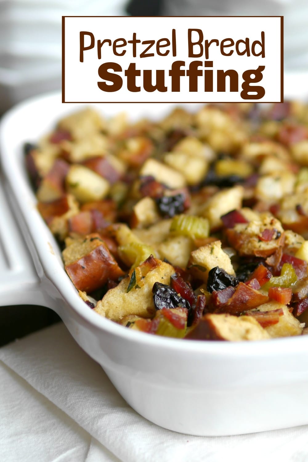 This pretzel bread stuffing combines the hearty texture of pretzel rolls with the savory richness of bacon and the subtle sweetness of apples, creating a unique twist on a classic side dish. Perfect for those looking to add a flavorful and unconventional element to their holiday table. via @cmpollak1