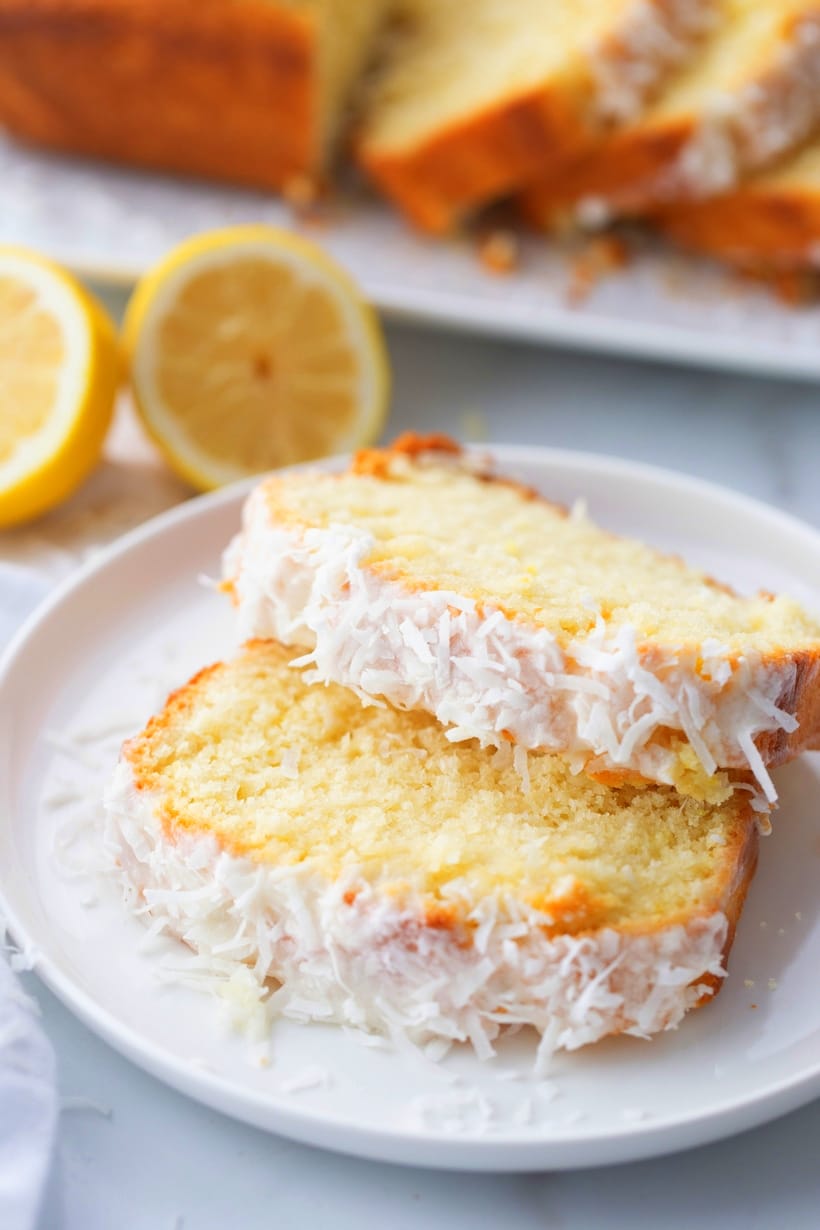 Overhead view of sliced lemon loaf, showcasing the moist texture.