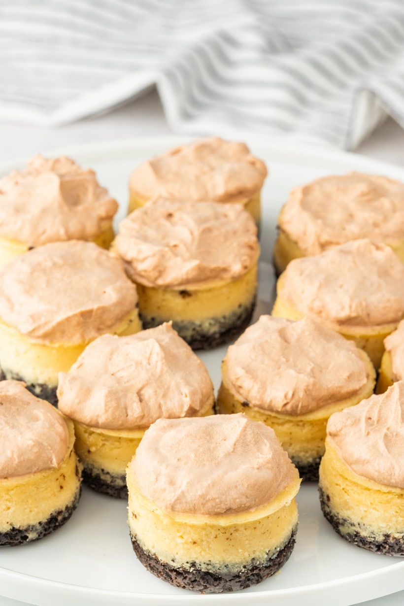 These irresistible mini-sized espresso cheesecakes are nestled on a Oreo cookie base and crowned with a luscious cloud of chocolate whipped topping that is generously dusted with cocoa powder. These mini cheesecakes are an indulgence fit for any occasion, with a special nod to the holiday season. mini coffee cheesecakes