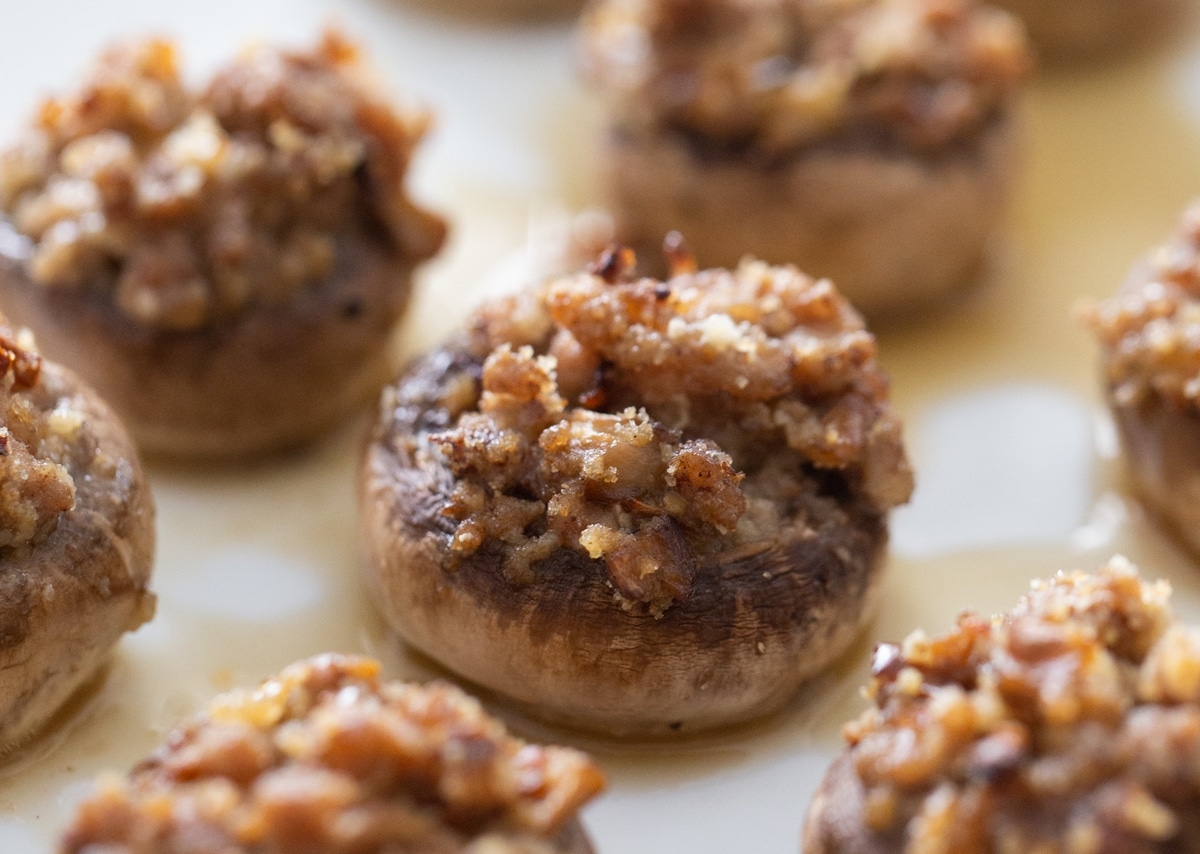 Pork Stuffed mushrooms out of the oven. pork stuffed mushrooms on a platter