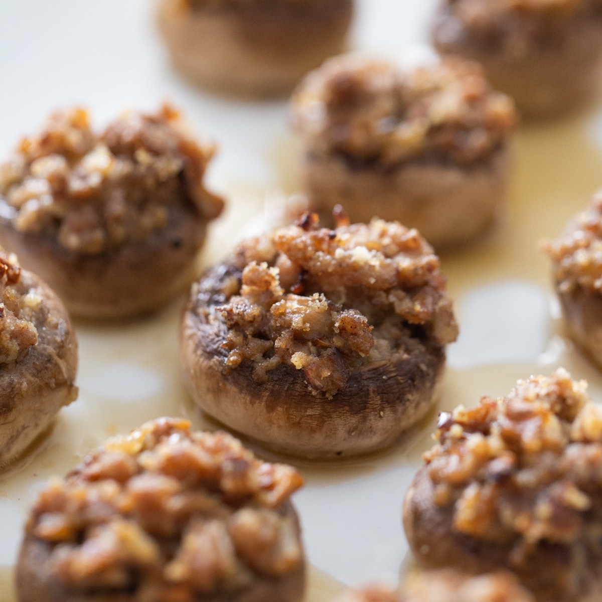 Pork Stuffed mushrooms filled and ready to eat. golden brown pork stuffed mushrooms